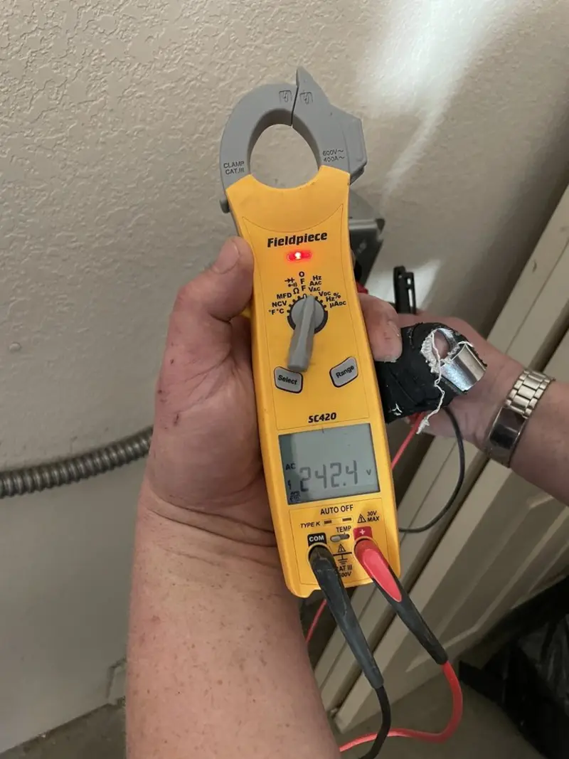 Voltage testing with clamp meter during Whole House Surge Protector in Annetta